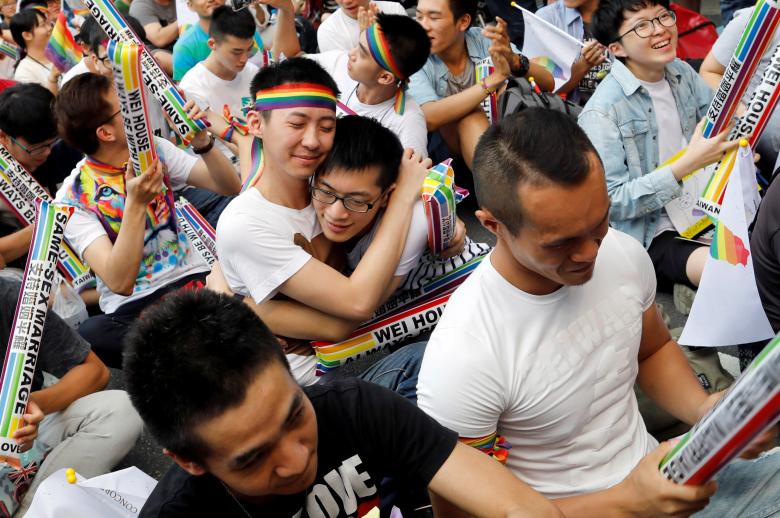 Supporters hug each other during a rally after Taiwan's constitutional court ruled that same-sex couples have the right to legally marry, the first such ruling in Asia, in Taipei, Taiwan May 24, 2017. REUTERS/Tyrone Siu